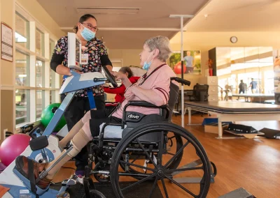 a resident with a rehab therapist in the rehab gym at Los Altos Sub-acute