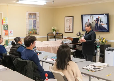 residents in a continuing education class with a caregiver at Los Altos Sub-acute