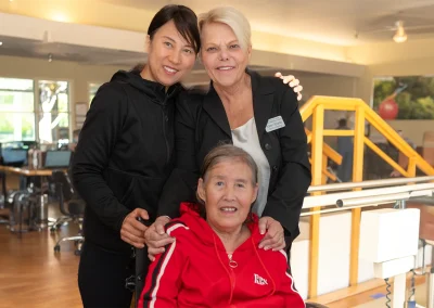 a resident with two rehab therapists in the rehab gym at Los Altos Sub-acute